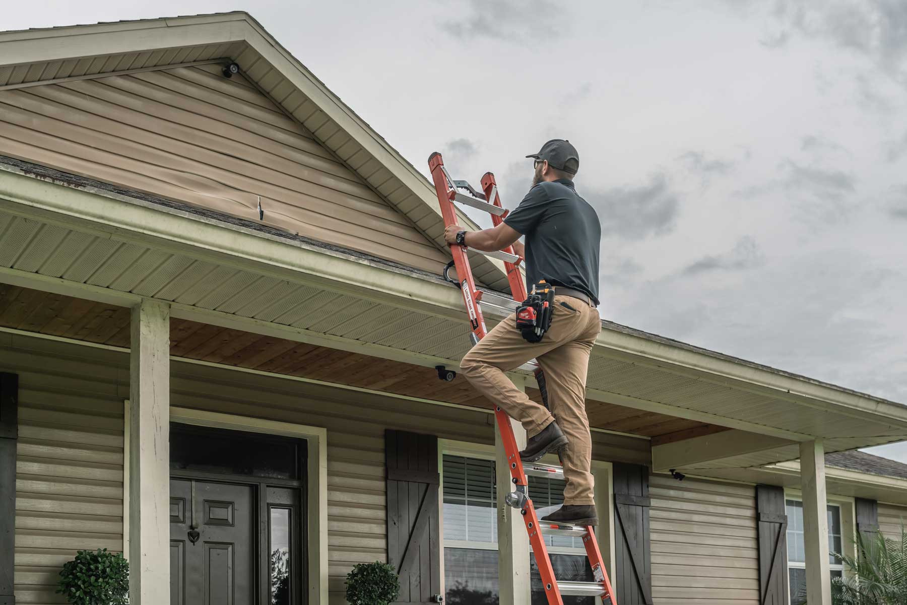 Inspector accessing a roof for an inspection