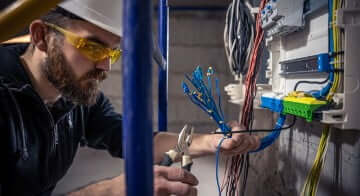 Man inspecting home electrical system