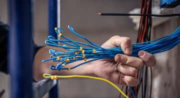 Home inspector checking electrical system