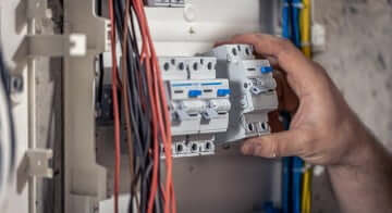 Inspector checking electrical switches