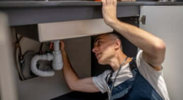 Home inspector inspecting sink